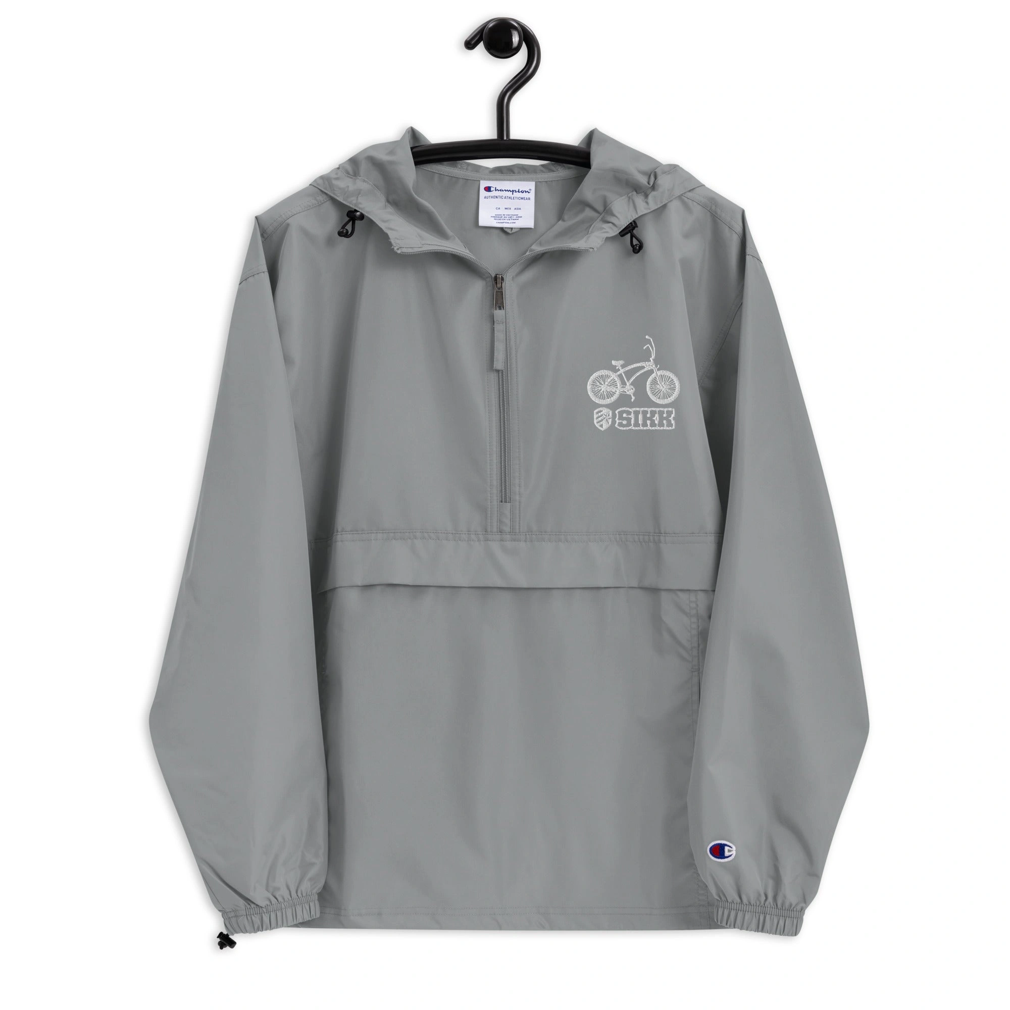 Chaqueta Champion Packable Bordada: ¡Ligera, Estilosa, y Lista para la Aventura! Un campeón en tu mochila.